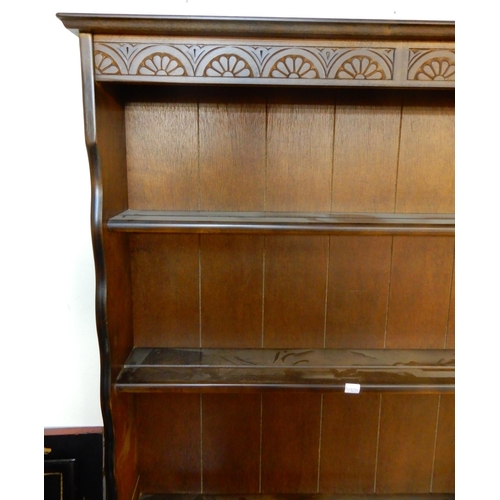 71 - A 20th century mahogany kitchen dresser with plate rack over two drawers over pair of cabinet doors,... 