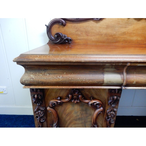 84 - A Victorian mahogany pedestal sideboard with carved scrolled back splash over long drawer flanked by... 