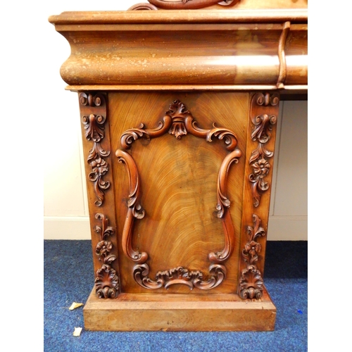 84 - A Victorian mahogany pedestal sideboard with carved scrolled back splash over long drawer flanked by... 