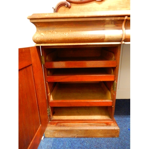 84 - A Victorian mahogany pedestal sideboard with carved scrolled back splash over long drawer flanked by... 