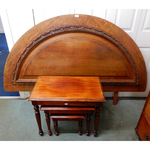 87 - A 20th century oak demi lune head board, 113cm high x 180cm wide and a mahogany nest of three tables... 