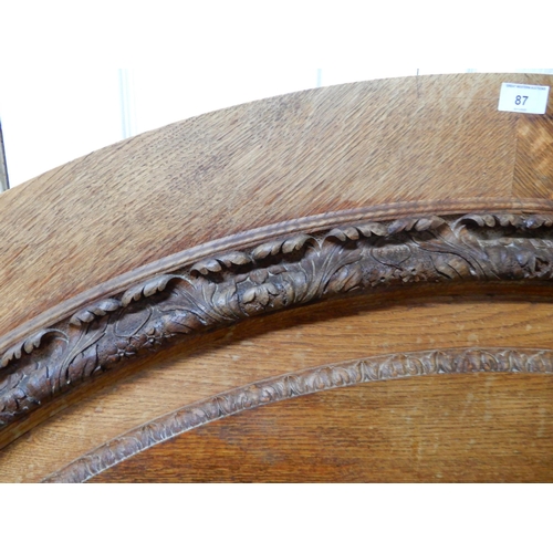 87 - A 20th century oak demi lune head board, 113cm high x 180cm wide and a mahogany nest of three tables... 