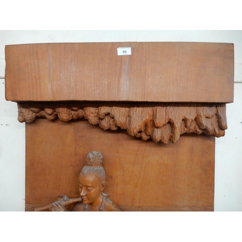 95 - A 20th century hardwood wall sculpture of a piper and a mermaid, 162cm high x 65cm wide