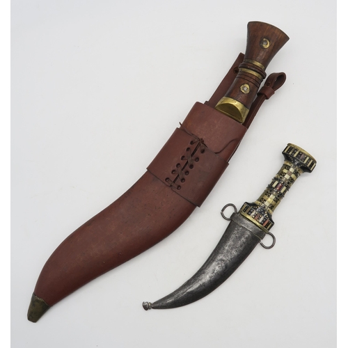 534 - A large kukri (blade measuring approx. 35cm in length) and a Middle Eastern jambiya dagger with bone... 