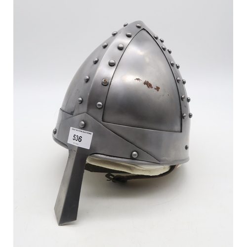 536 - A reproduction Norman nasal helmet, with leather liner and additional padded cloth cap