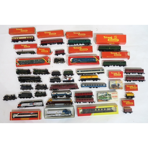 613 - A quantity of 00-Gauge model railway locomotives and stock, largely by Hornby and Tri-ang, many boxe... 