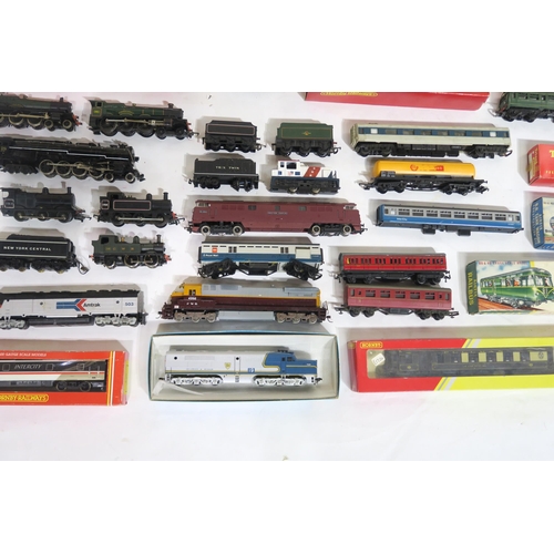 613 - A quantity of 00-Gauge model railway locomotives and stock, largely by Hornby and Tri-ang, many boxe... 