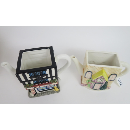 719A - A collection of 4 novelty pottery teapots depicting 4 various cottages with a village shop theme by ... 