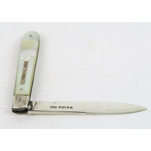 748A - A Victorian silver and mother of pearl fruit knife, the handle with a blank rectangular cartouche, t... 