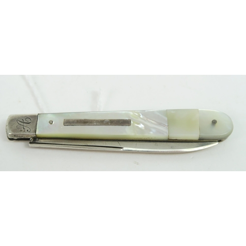 748A - A Victorian silver and mother of pearl fruit knife, the handle with a blank rectangular cartouche, t... 