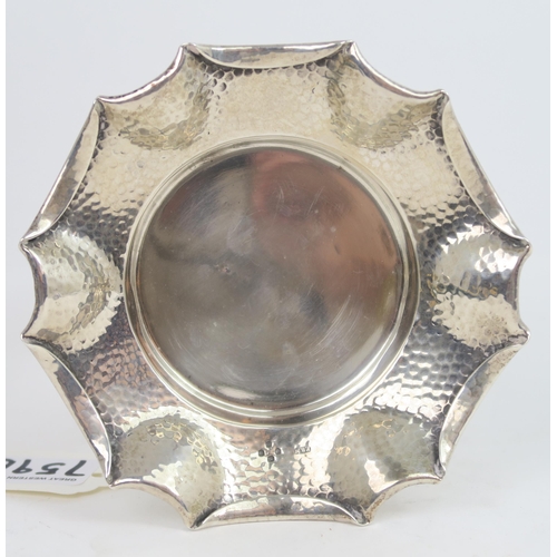 759B - A Victorian silver arts and crafts style dish, the body with a hammered finish, with a fold over pie... 