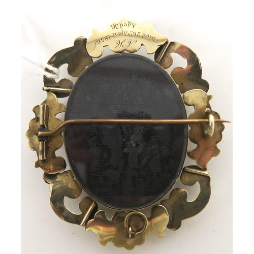 759C - A Victorian memorial hair art brooch. The scrolling yellow metal pendant brooch, has a locket to bot... 