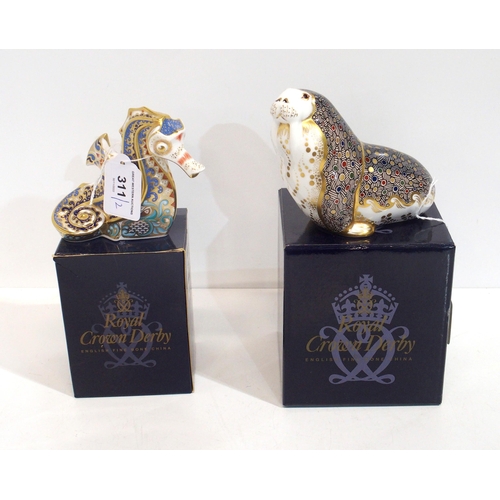 311 - A Royal Crown Derby paperweight of a Walrus, and another of a seahorse, both with gold stoppers