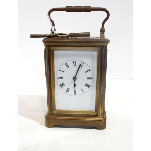 315 - A brass and glass repeating carriage clock, with roman numerals to the dial