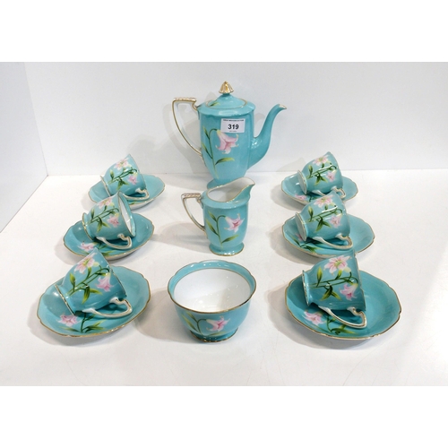 319 - A Noritake coffee set, the turquoise ground decorated with pink lilies