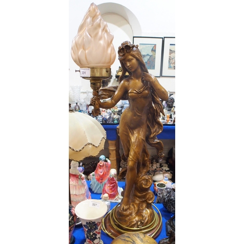 331 - After Moreau, a gilded figural lamp, modelled as a scantily clad female holding a torch