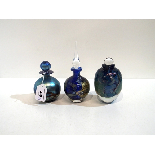 339 - An iridescent glass scent bottle, probably by Isle of Wight, together with two other scent bottles, ... 