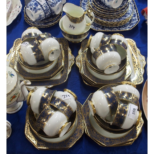 359 - A Paragon teaset the white ground with blue and gilt band