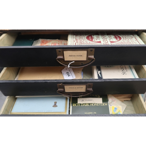 654 - A collector's cabinet of worldwide stamps