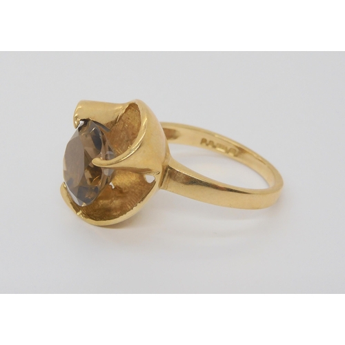 696 - A 9ct gold smoky quartz set ring, size M, weight 4.4gms