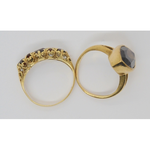 699 - A 9ct gold marquis shaped smoky quartz ring, size K, together with a garnet set ring, size L1/2, wei... 