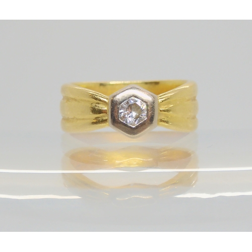 702 - An 18ct gold diamond ring, set with a 0.10cts brilliant cut diamond, finger size F, weight 4.1gms