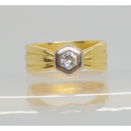 702 - An 18ct gold diamond ring, set with a 0.10cts brilliant cut diamond, finger size F, weight 4.1gms