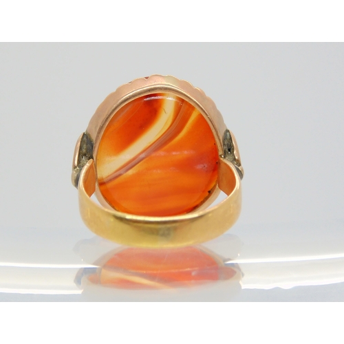 704 - An 18ct gold carnelian signet ring, size L1/2, weight 5.1gms