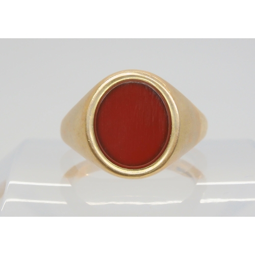 706 - A heavy 9ct gold carnelian signet ring, size W1/2, weight 10.5gms