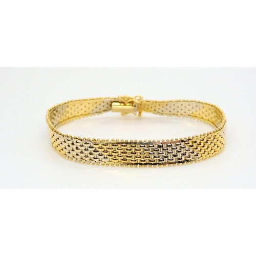 742 - A 14k yellow and white gold diagonal striped bracelet, length 18.5cm, weight 14.1gms