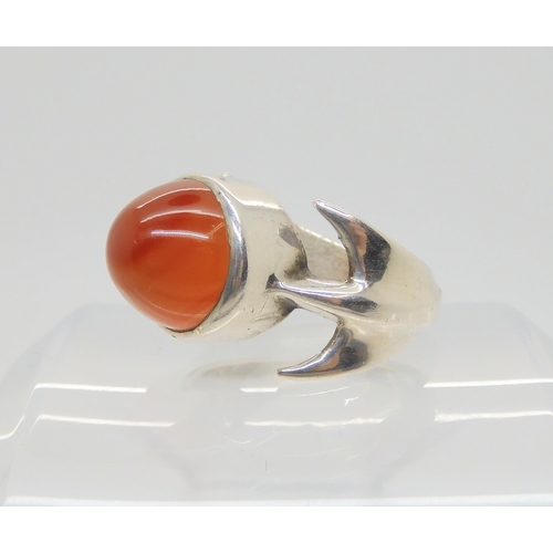 743 - A silver retro statement ring by Peter Guy Watson, set with a carnelian, hallmarked London 1972, fin... 