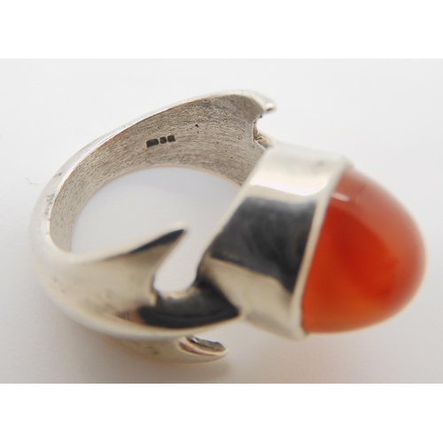 743 - A silver retro statement ring by Peter Guy Watson, set with a carnelian, hallmarked London 1972, fin... 