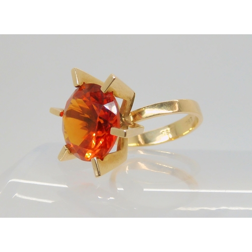 745 - A Danish 14ct gold retro ring by Ejner Bruno Christensen, set with an orange gem, finger size H1/2, ... 