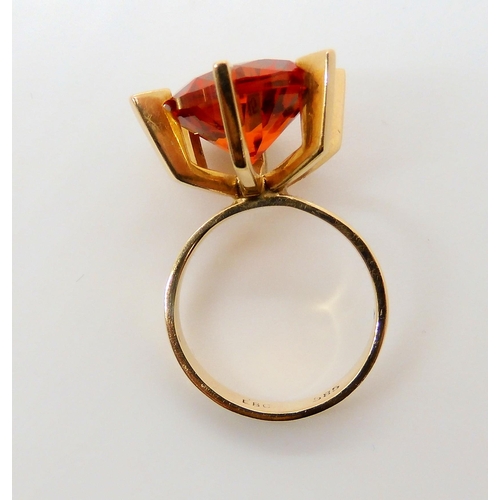 745 - A Danish 14ct gold retro ring by Ejner Bruno Christensen, set with an orange gem, finger size H1/2, ... 