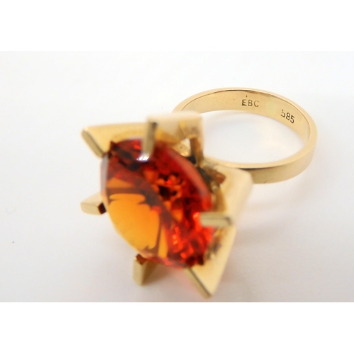 745 - A Danish 14ct gold retro ring by Ejner Bruno Christensen, set with an orange gem, finger size H1/2, ... 