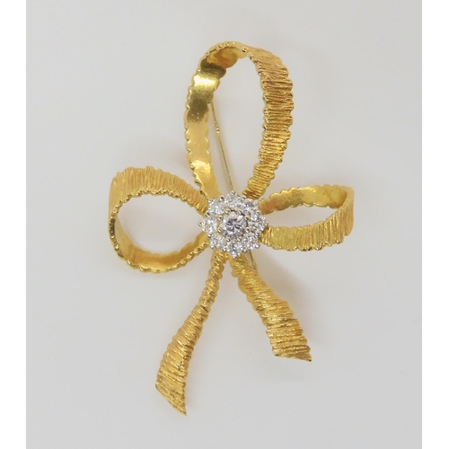 746 - An 18ct gold and diamond bow brooch made by Cropp & Farr Ltd, set with estimated approx 0.38cts ... 