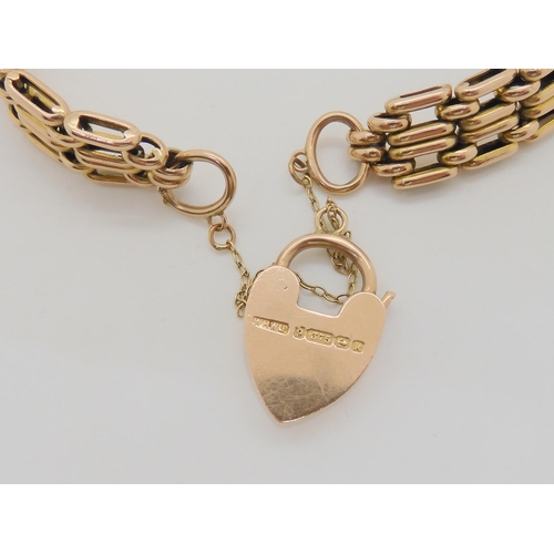 756 - A 9ct gold gate bracelet with a heart shaped clasp, length 19.5cm, weight 19gms