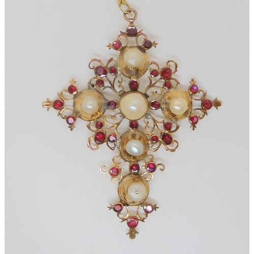 763 - A large pearl and garnet set cross, mounted in yellow metal, of foliage design, dimensions 8.8cm x 6... 