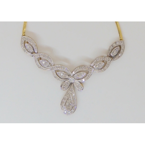 764 - A 9ct gold Italian made necklace, with the petal shaped links set with diamond melee, estimated appr... 