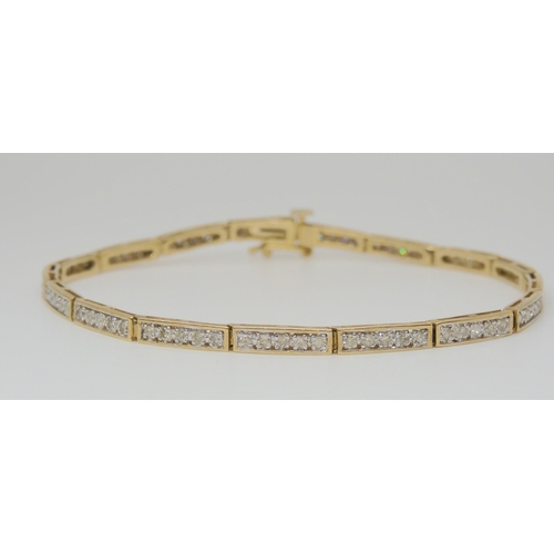 767 - A 9ct yellow gold diamond set bracelet, set with estimated approx 0.80cts of eight cut diamonds leng... 