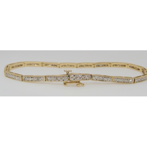 767 - A 9ct yellow gold diamond set bracelet, set with estimated approx 0.80cts of eight cut diamonds leng... 