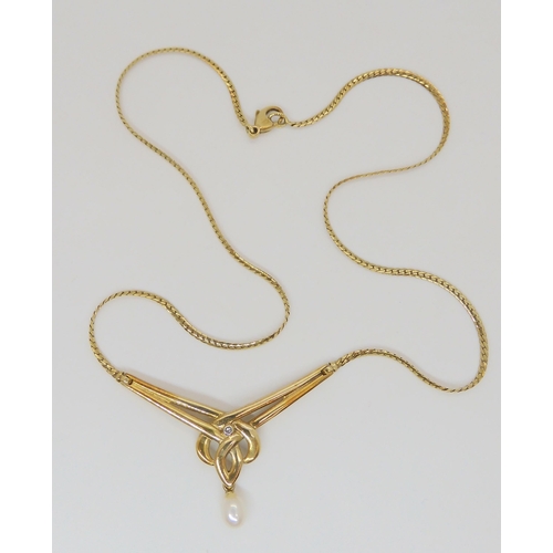 768 - A 9ct gold knotwork necklet with a pearl drop and set with a diamond accent, length of knot panel 4.... 