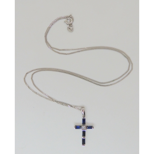 769 - An 18ct white gold sapphire and princess cut diamond cross pendant, length with bail 2.3cm, weight 1... 