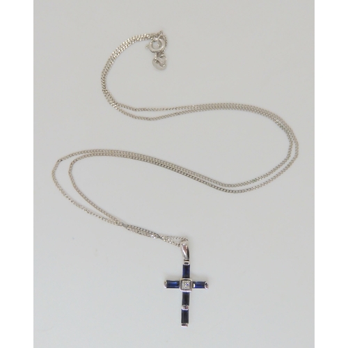 769 - An 18ct white gold sapphire and princess cut diamond cross pendant, length with bail 2.3cm, weight 1... 