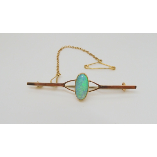 773 - A 9ct gold opal brooch, approx size of the solid opal 11.5mm x 5.5mm x 3.3mm in milgrain setting, we... 