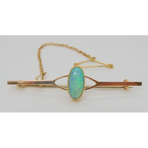 773 - A 9ct gold opal brooch, approx size of the solid opal 11.5mm x 5.5mm x 3.3mm in milgrain setting, we... 