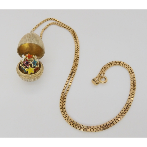 777 - A silver gilt Stuart Devlin surprise egg pendant, on a 9ct gold box chain, length 44cm, weight 5.6gm... 