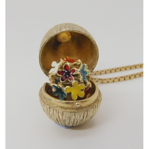 777 - A silver gilt Stuart Devlin surprise egg pendant, on a 9ct gold box chain, length 44cm, weight 5.6gm... 