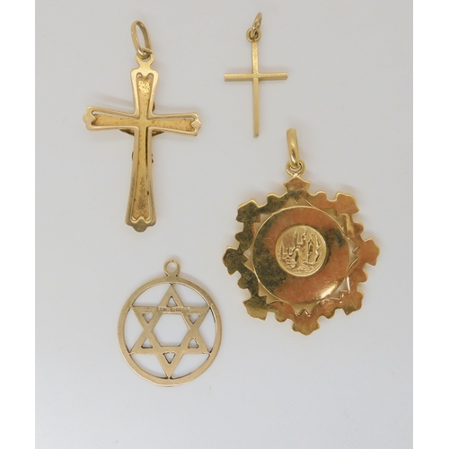 786 - A collection of 9ct and yellow metal, a crucifix, cross, star of David and Madonna pendant, weight t... 