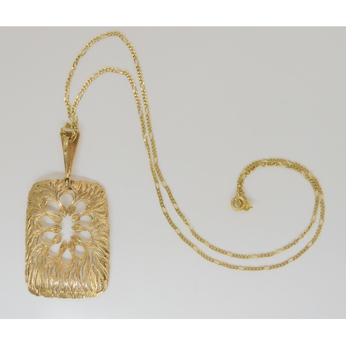 787 - A 9ct gold retro pendant with London import marks dated 1972, weight 7.2gms, with a 14k gold figaro ... 